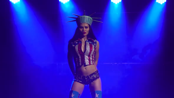 Attractive Brunette in a Sexy Suit American Statue of Liberty Dancing in a Dark Studio with Smoke alt