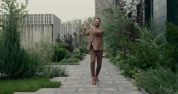 Joyful Bearded Man Glasses Snapping His Finger Whistling While Having Good Mood alt