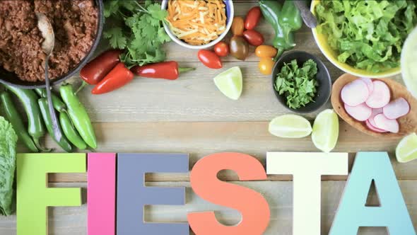 Ground beef tacos with romaine lettuce, diced tomatoes, radishes, and shredded cheddar cheese. alt