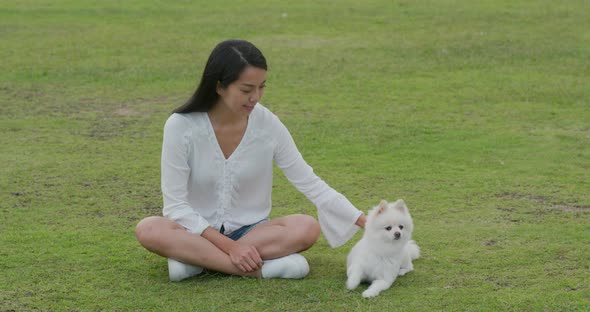 Woman play with her dog at park