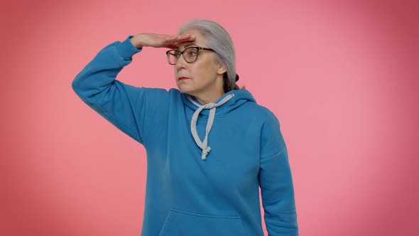 Mature Old Grayhaired Grandmother Holding Hand Above Eyes Peering Into Distance Searching Someone alt