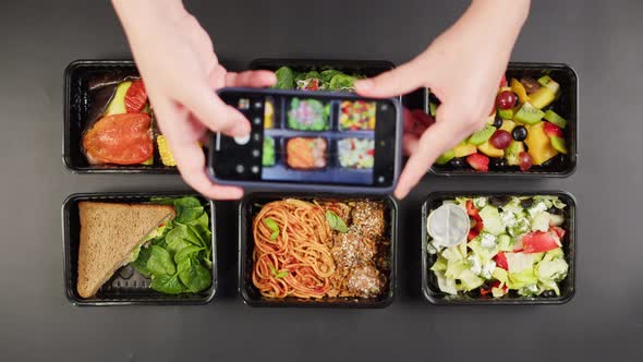 Taking Photo of Food Delivery in Disposable Containers on Phone Take Away Meals Top View Balanced alt