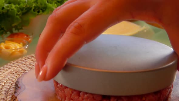 Panorama of the Hand Taking Away a Pressing Form for Making a Minced Meat Cutlet alt