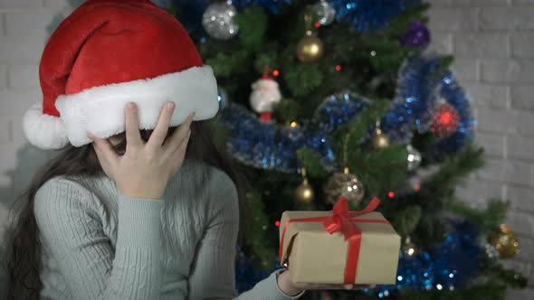 Child expressing disappointment for present. alt