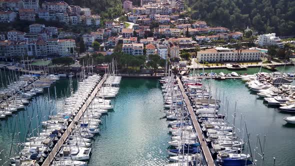 Drone view on beautiful Fethiye city and Fethiye harbor full of yachts and boats