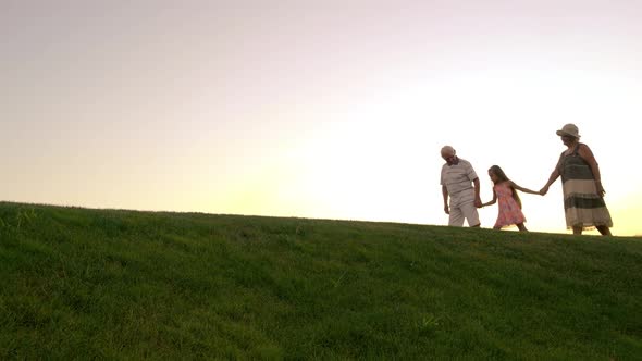 Girl and Grandparents, Sunset Sky. alt
