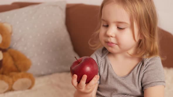 Little Girl Child Eats Apple Healthy Food Snack Bedroom