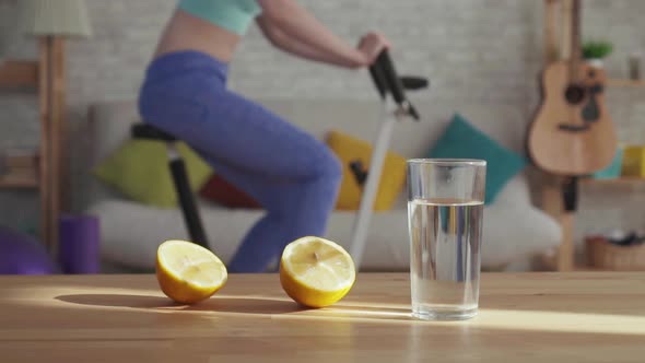 Concept of Weight Loss and Proper Nutritiona Glass of Water and Lemons on the Table alt