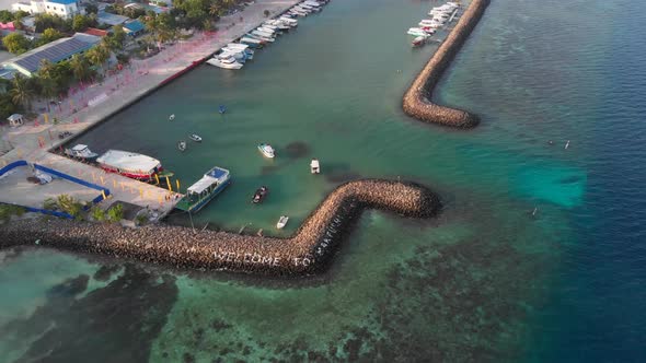 Aerial of Maldives dock to city alt
