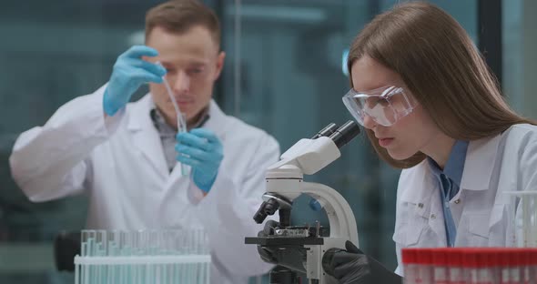 Team of Medical Scientists Are Developing Vaccine From Coronavirus in Medical Laboratory, Man and alt