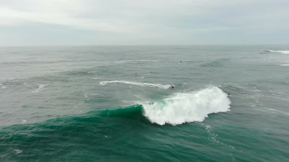 Tourist Drives Scooter on Amazing Ocean Wave Bird Eye View alt