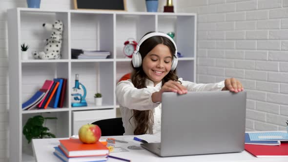 Joyful Female Student in School Uniform and Headset Glad After Finishing Studying Elearning