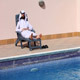 Saudi Arabian Using Phone At Swimming Pool - VideoHive Item for Sale