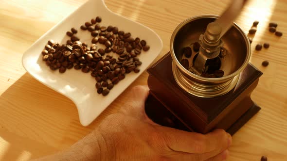 Grinding Coffee Beans with Manual Vintage Coffee Mill