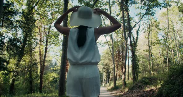 Romantic Young Adult Woman Walk on Forest at Summer Vacations and Smile alt