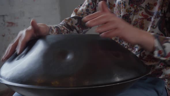 Musician Hands Playing Handpan Drum. Close Up