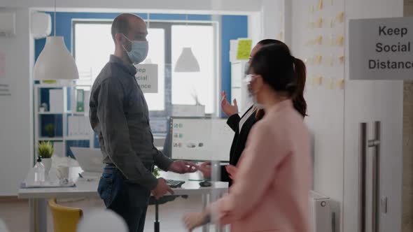 Company Team with Medical Face Mask Touching Elbow to Avoid Coronavirus Infection alt