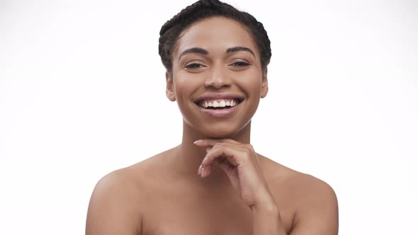 Positive African American Lady with Laughing at Camera White Studio Background alt