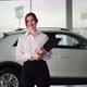 Portrait of Auto Sales Female Manager Holding Keys in Front of a New Car Smiling and Looking at - VideoHive Item for Sale