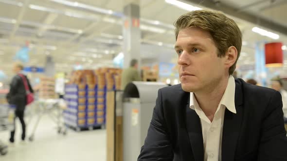 Portrait of Businessman Inside the Supermarket