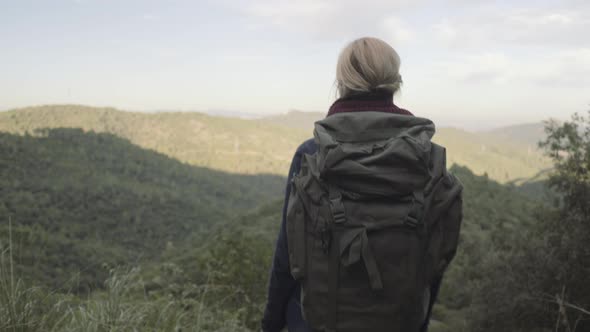 Young Adult Female Traveling and taking picture on view point