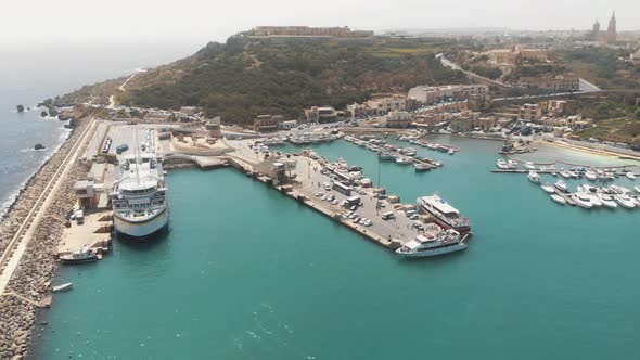 4k aerial drone footage panning right to the city of Gozo on the island of Malta, Mediterranean Sea alt