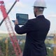 Confident Young Architect with Tablet Planning Project at Construction Site Back View - VideoHive Item for Sale