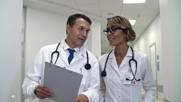 Healthcare Workers Talking and Going through Hospital alt