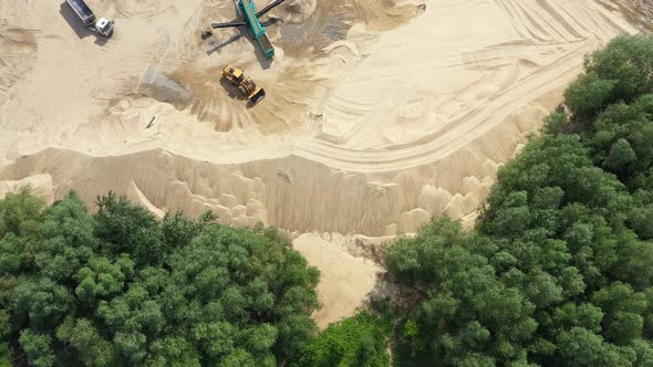 Aerial view of the sand quarry with heavy equipment alt