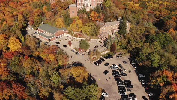 Aerial Drone Holy Hill Basilica Wisconsin with Fall Colored Trees in Forest