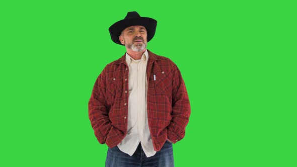 Serious American Farmer Looking at Camera and Talking on a Green Screen Chroma Key alt