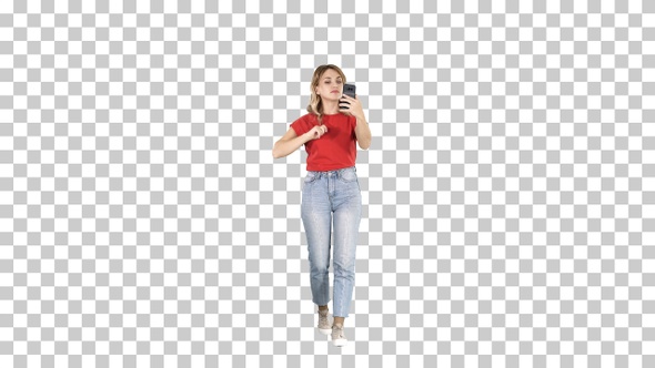 Blonde walking and preening looking in the phone, Alpha Channel alt