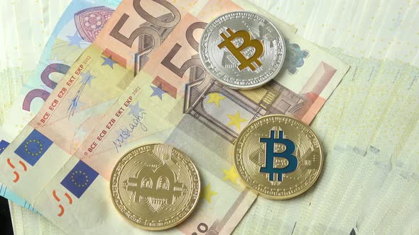 Bitcoins close-up on euro currency background. 