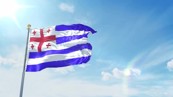 National Flag of Ajaria waving against the blue sky alt