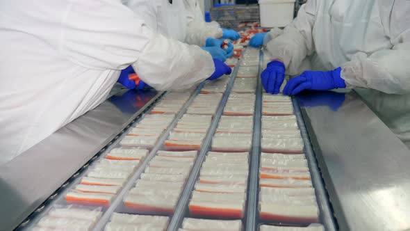 Industrial Workers Are Packaging Crab Products alt