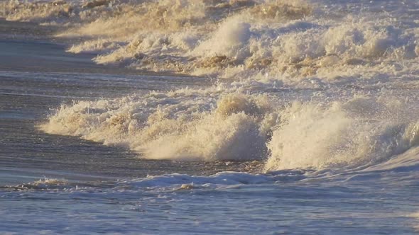 Waves break in surf line. alt