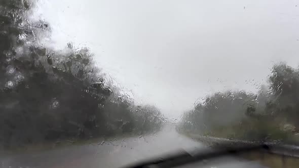Driving through heavy rain storm epic road travel