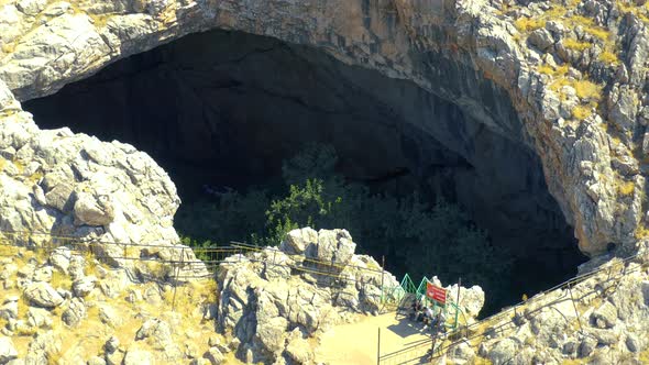 Trees on Sinkhole Akmechet Cave in Shymkent Kazakhstan alt