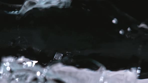 Super Slowmotion Shot of Water Wave Against Black at 1000 Fps alt