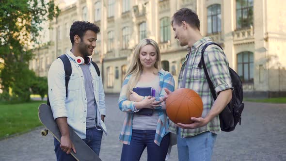 Students Standing Near College, Chatting and Flirting. Blonde Choosing Boyfriend alt