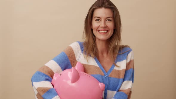 Woman Kissing Coin For Piggybank alt