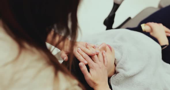 Woman Receiving a Facial Massage alt