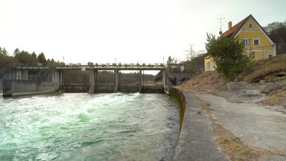 Foaming water behind a working weir with the speed ramp effect wo show the motion of the river fastl alt