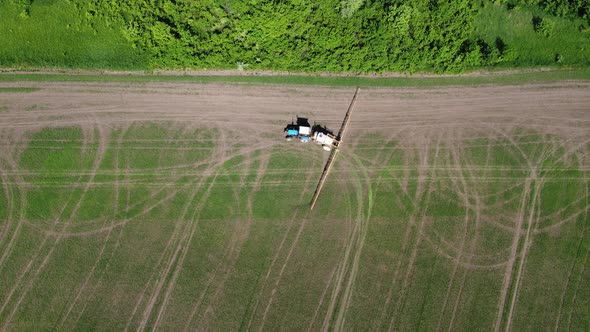 Processing of Agricultural Fields with Fertilizers and Pesticides From Weeds and Pests