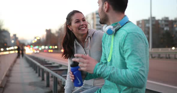 Beautiful Couple Talking After Fitness Exercising and Jogging