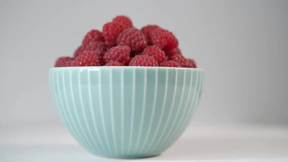 Sweet Raspberries in a Cute Blue Plate