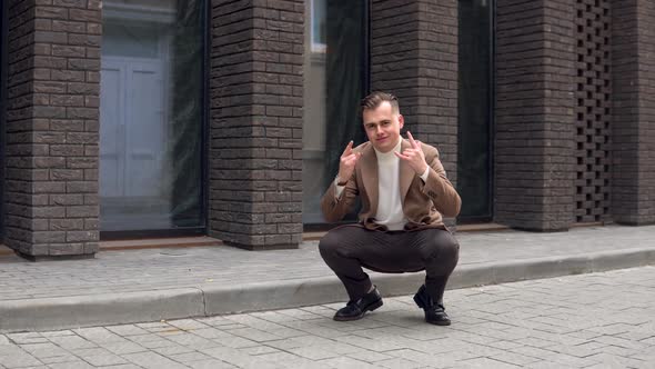 Confident Fashionable Man in Brown Coat on Brick Wall Background alt