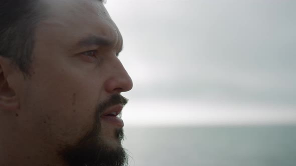 Portrait Calm Sportsman Looking in Distance Meditating Outdoors Cloudy Day alt