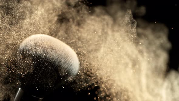 Super Slow Motion Closeup Shot of Makeup Powder Falling From Facial Brush at 1000Fps alt