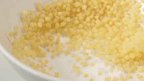 Couscous Fall On White Dish alt